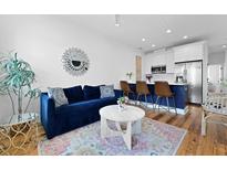 Inviting living room featuring a comfortable blue sofa and stylish decor at 142 President St, Charleston, SC 29403