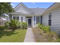 Charming home entrance with well-kept garden, gray siding, and blue shutters at 1470 Ashley Gardens Blvd, Charleston, SC 29414