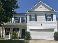 Charming two-story home featuring white siding, blue shutters, and an attached two-car garage at 2021 Asher Loop, Summerville, SC 29485