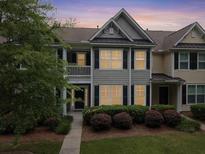 Charming townhome featuring a landscaped front yard, welcoming entrance, and neutral color scheme at 2064 Promenade Ct, Mount Pleasant, SC 29466