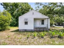 Charming single-story home with a well-manicured lawn and a cozy front porch, perfect for enjoying the outdoors at 2373 Sorentrue Ave, North Charleston, SC 29405
