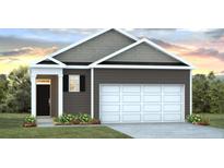 Charming one-story home with a garage, black door, green lawn, and neutral toned siding at 297 Watersglen Dr, Summerville, SC 29486
