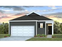 Charming one-story home with a white garage door, dark siding, complemented by manicured lawn and flowering plants at 311 Watersglen Dr, Summerville, SC 29486