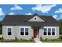 Charming single-story home with light gray siding, black roof, and a well-manicured lawn and shrubbery at 336 Trailmore Ln, Summerville, SC 29486
