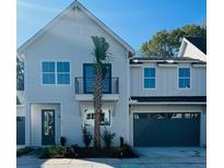 Beautiful two story home with a charming front yard and a spacious two-car garage at 405 Oak Hammock Ct # 49, Johns Island, SC 29455