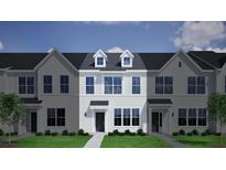 Charming new two-story townhouse with dormers, a well manicured lawn and neat landscaping at 127 Brown Swiss Cir, Summerville, SC 29483