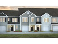 Charming townhome featuring craftsman-style architecture, attached garages, and manicured landscaping at 133 Haventree Ct, Summerville, SC 29486