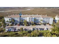 Multi-level condo with boat parking, with direct access to the marsh and waterway at 138 W Mariners Cay Dr, Folly Beach, SC 29439