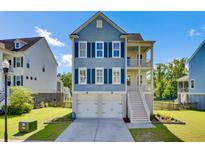 Charming two-story home with a driveway, garage, and a welcoming front porch under a blue sky at 2820 Merriams Dr, Charleston, SC 29414