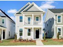 Charming two-story home with a welcoming porch and manicured front yard at 316 O'Malley Dr, Summerville, SC 29483