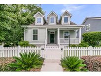Charming home with a white picket fence and well-manicured landscaping at 3408 Salterbeck St, Mount Pleasant, SC 29466