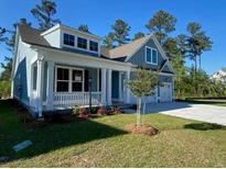 Charming single-Gathering home with a covered porch, lush lawn, and ample parking at 771 Maynard Ln, Summerville, SC 29486