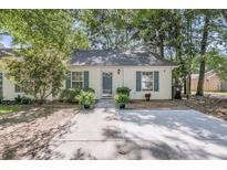 Charming single-story home with a well-manicured lawn, inviting entrance, and lovely curb appeal at 1705 Bassett Ct, Charleston, SC 29412