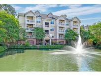 Attractive condo complex with a fountain and well-maintained landscaping, near a pond and mature trees at 2244 Ashley Crossing Dr # 532, Charleston, SC 29414