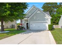 Charming home with a well-manicured lawn, two-car garage, and inviting curb appeal at 3364 Middlesboro Ave, Summerville, SC 29485
