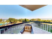 Enjoy ocean views from this private balcony with comfortable seating and cool breezes at 4209 Ocean Club Dr, Isle of Palms, SC 29451