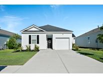 Charming one-story home featuring white siding, a black door, and an attached one-car garage with driveway at 1014 Peridote Way, Ladson, SC 29456