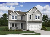 Charming two-story home featuring a classic architectural style and a well-manicured front lawn at 2042 Mcguire Ln # 011, Hollywood, SC 29449
