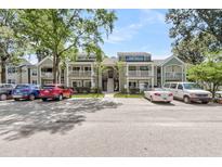 Attractive condos featuring balconies, manicured lawns, and ample parking at 2317 Tall Sail Dr # 1005, Charleston, SC 29414