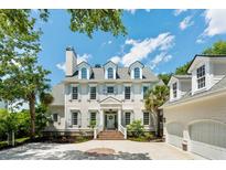 Stately home featuring blue shutters, dormer windows, and a brick walkway to the front door and two-car garage at 3508 Henrietta Hartford Rd, Mount Pleasant, SC 29466