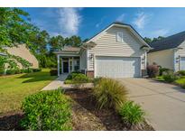 Charming one-story home with a two-car garage, well-manicured lawn and shrubbery at 626 Battery Edge Dr, Summerville, SC 29486