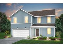 Charming two-story home with blue siding, a garage, and well-manicured landscaping creating curb appeal at 740 Meadowbrook Lane, Summerville, SC 29486