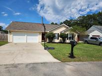 Charming single Gathering home with a two car garage and a well maintained lawn at 102 Jasimine Ct, Summerville, SC 29486