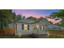 Charming bungalow home features a cozy front porch, modern design, and a well-maintained landscaped yard at 1430 E Montague Ave, North Charleston, SC 29405