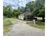 Charming single story home with mature trees and a small front porch at 1902 Clifton St, North Charleston, SC 29406