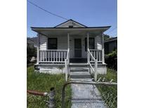 Charming home featuring a classic front porch, enhancing its curb appeal at 1978 Beech Ave, North Charleston, SC 29405