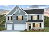 Charming two-story home showcasing a stylish gray exterior, well-manicured lawn, and an attached two-car garage at 225 Wild Strawberry Ln, Moncks Corner, SC 29461