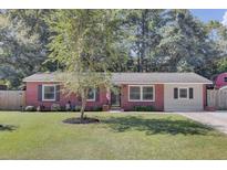 Charming single-story brick home with a well-manicured lawn and mature tree in the front yard at 25 Aldene Ave, Goose Creek, SC 29445