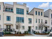 Beautifully designed multi-story townhouse with large windows and manicured landscaping at 405 Spartina Ln # 405, Charleston, SC 29492