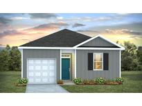 Charming single-story home with a gray exterior, a garage, a blue front door, and a well-manicured lawn at 414 Mistflower Ln, Moncks Corner, SC 29461