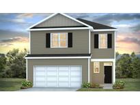 Charming two-story home with black shutters, a two-car garage, and manicured front lawn at 421 Mistflower Ln, Moncks Corner, SC 29461