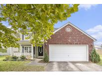 Charming two-story home with brick accents and an attached garage on a sunny day at 4987 Ballantine Dr, Summerville, SC 29485