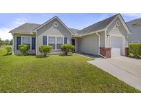 Charming single-story home with a well-maintained lawn, siding, and an attached one-car garage at 5040 Thornton Dr, Summerville, SC 29485