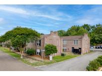 Charming multi-Gathering building featuring brick facade and landscaped surroundings at 867 Colony Dr # F92, Charleston, SC 29407
