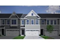 Charming gray townhome with a spacious two-car garage and beautiful architectural details at 124 Brown Swiss Cir, Summerville, SC 29483
