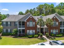 Attractive multi-story condo building with brick and siding exterior and well-manicured lawn at 1335 Hopton Cir # 1335, Mount Pleasant, SC 29466