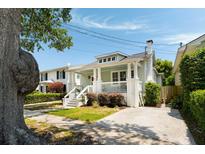 Charming traditional home with a welcoming front porch and well-manicured landscaping at 158 Darlington Ave, Charleston, SC 29403