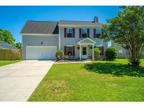 Charming two-story home with red shutters, lush green lawn, and a welcoming front porch at 208 Waterford Ln, Summerville, SC 29483
