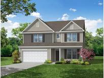 Charming two-story home with a landscaped yard, attached two car garage, and neutral color palette at 216 Palfrey Dr, Ridgeville, SC 29472