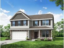 Charming two-story home with stone accents, a covered porch, and a two-car garage at 222 Palfrey Dr, Ridgeville, SC 29472