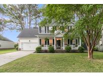 Charming two-story home with a welcoming front porch and well-manicured lawn at 2467 Bergeron Way, Mount Pleasant, SC 29466