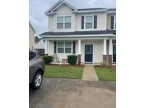 Charming two-story home with well-maintained lawn and inviting entrance at 9217 Southern Oak Ln, Ladson, SC 29456