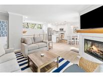 Bright living space with fireplace, modern furnishings, and open floor plan to the kitchen and dining area at 1355 Dunlin Ct # Share D, Kiawah Island, SC 29455