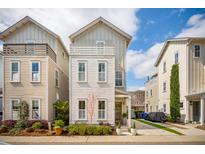 Charming two-story home with white siding and a well-manicured lawn in a desirable neighborhood at 137 Bratton Cir, Mount Pleasant, SC 29464