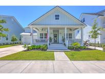 Charming single-Gathering home with a welcoming front porch, manicured lawn, and inviting curb appeal at 1787 Timmons St, Mount Pleasant, SC 29466