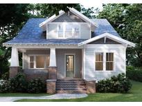 Charming craftsman-style home with inviting front porch and brick accents offers timeless curb appeal at 2101 Wappoo Dr, Charleston, SC 29412
